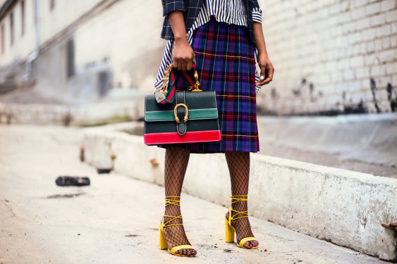 woman carrying fashion leather handbag